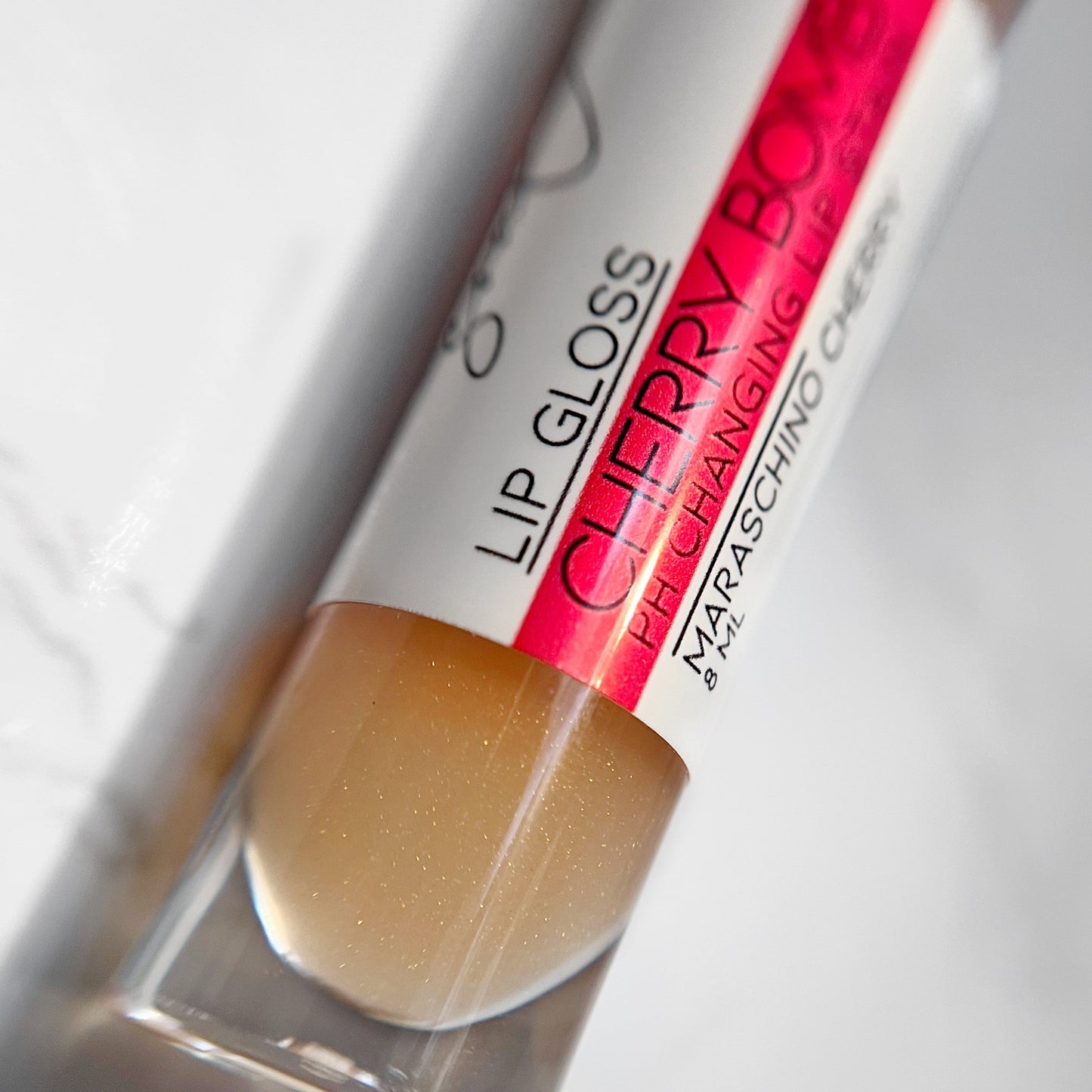 Color changing lip gloss that changes with your unique pH, "Cherry Bomb by Lather and Soul