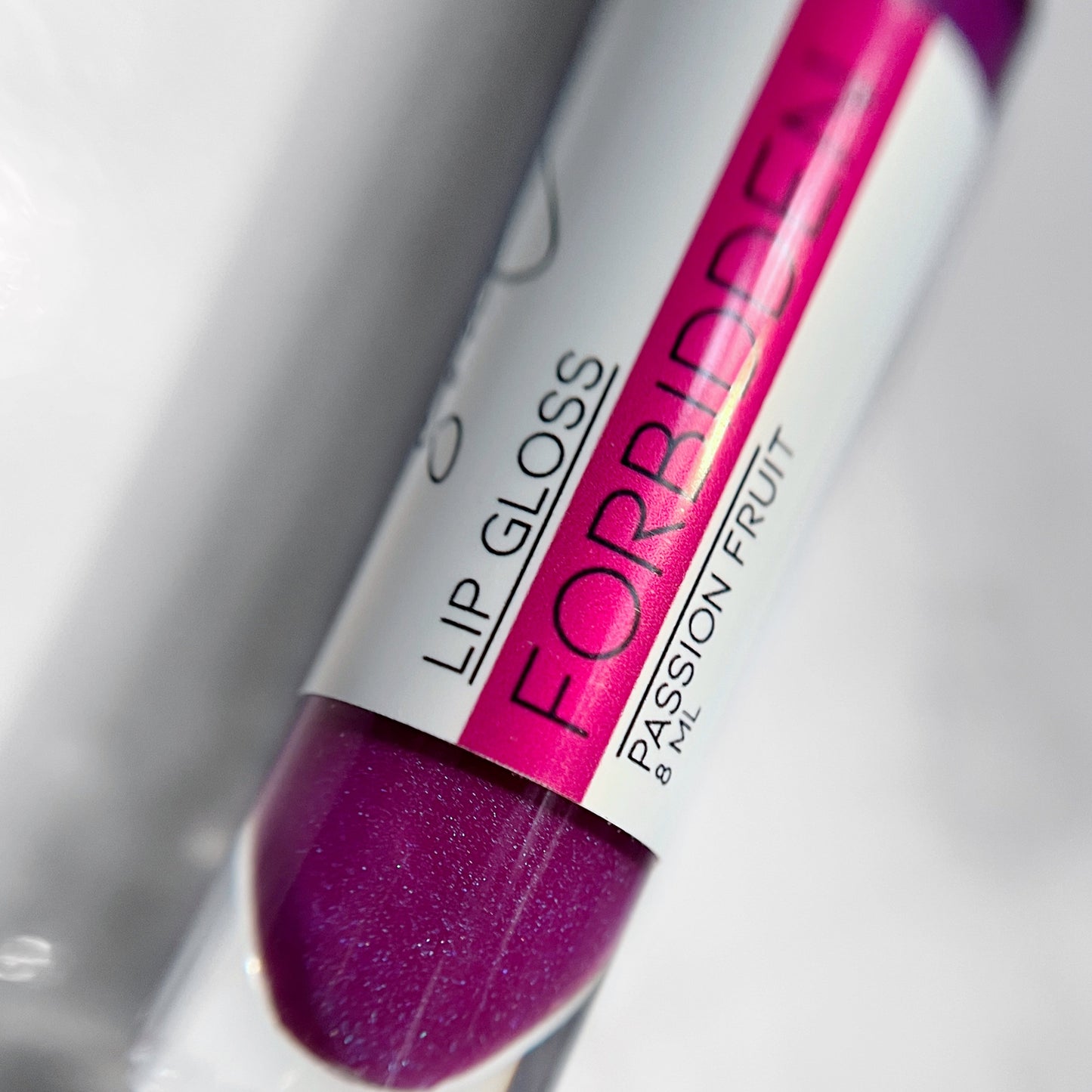 Sheer purple shimmer lip gloss, "Forbidden" by Lather and Soul